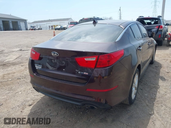 2014 Kia Optima EX z VIN 5XXGN4A77EG338455, wystawiony jako IAAI lot #42071765 z przebiegiem 136 331 mil mil oraz . Historia ofert i sprzedaży dostępna na DreamBid. Obrazek 4.