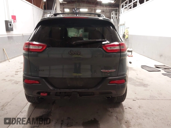 2015 Jeep Cherokee Trailhawk with VIN 1C4PJMBS6FW724931, listed as a IAAI auction lot 41602181 with 153,340 mi miles and . Bid and sale history available at carsss.com. Image 17.