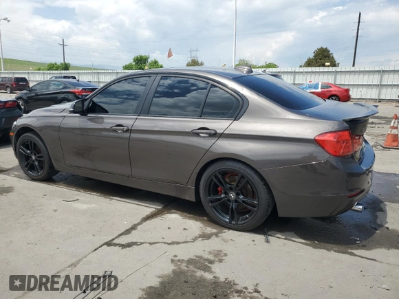 2014 BMW 3 Series 320i xDrive with VIN WBA3C3C53EK200375, listed as a Copart auction lot 59915595 with 104,320 mi miles and Salvage title. Bid and sale history available at DreamBid. Image 2.