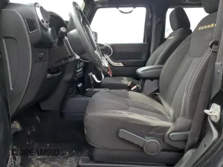 2014 Jeep Wrangler Sahara with VIN 1C4AJWBG0EL306703, listed as a Copart auction lot 51450215 with 115,932 mi miles and Salvage Title. Bid and sale history available at DreamBid. Image 7.