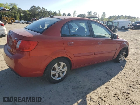 2010 Kia Rio LX with VIN KNADH4A32A6678111, listed as a Copart auction lot 52632895 with 98,392 mi miles and Salvage Title. Bid and sale history available at carsss.com. Image 3.
