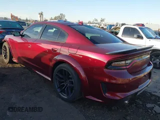 2022 Dodge Charger Scat Pack Widebody with VIN 2C3CDXGJ5NH189146, listed as a IAAI auction lot 41603805 with 30,212 mi miles and . Bid and sale history available at DreamBid. Image 3.