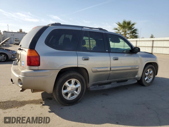 2003 GMC Envoy SLE with VIN 1GKDS13S332390989, listed as a Copart auction lot 74729104 with 127,680 mi miles and Salvage Title. Bid and sale history available at DreamBid. Image 3.