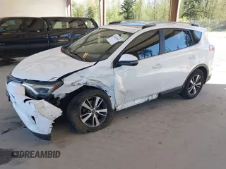 2018 Toyota RAV4 XLE with VIN JTMRFREVXJD240388, listed as a IAAI auction lot 42052065 with 117,114 mi miles. Bid and sale history available at carsss.com. Image 18.
