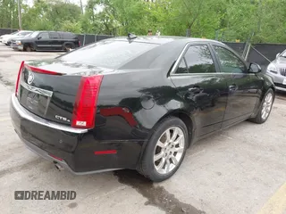2009 Cadillac CTS AWD w/1SB with VIN 1G6DT57V290165006, listed as a IAAI auction lot 42144947 with 162,969 mi miles. Bid and sale history available at carsss.com. Image 4.