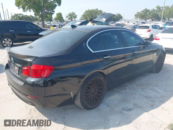 2012 BMW 5 Series 528i with VIN WBAXG5C58CDX05153, listed as a IAAI auction lot 42196906 with 120,652 mi miles. Bid and sale history available at carsss.com. Image 4.