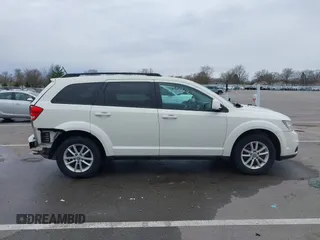 2013 Dodge Journey SXT with VIN 3C4PDCBG9DT564303, listed as a IAAI auction lot 41954764 with 132,125 mi miles. Bid and sale history available at carsss.com. Image 14.
