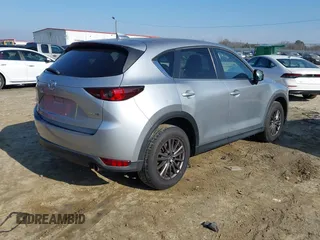 2020 Mazda CX-5 Touring with VIN JM3KFACM8L0727393, listed as a IAAI auction lot 41492627 with 91,521 mi miles. Bid and sale history available at carsss.com. Image 4.