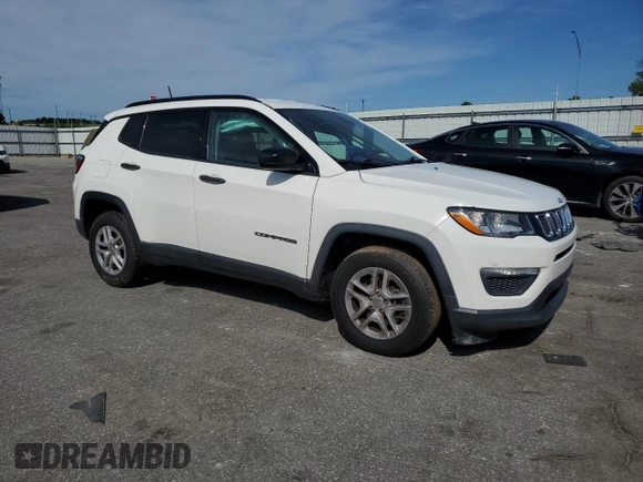 2018 Jeep Compass Sport with VIN 3C4NJCAB7JT140622, listed as a Copart auction lot 58162185 with 128,686 mi miles and Salvage title. Bid and sale history available at DreamBid. Image 4.