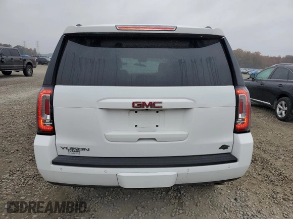 2019 GMC Yukon SLT with VIN 1GKS2BKC2KR338007, listed as a Copart auction lot 82336394 with 105,087 mi miles and Salvage Title. Bid and sale history available at carsss.com. Image 6.