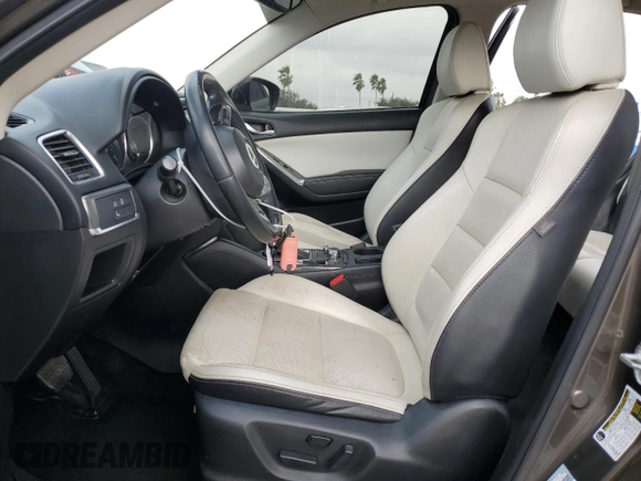 2016 Mazda CX-5 Grand Touring z VIN JM3KE2DY7G0735355, wystawiony jako Copart lot #49438285 z przebiegiem 132 731 mil mil oraz Szkoda całkowita • Salvage title. Historia ofert i sprzedaży dostępna na DreamBid. Obrazek 7.