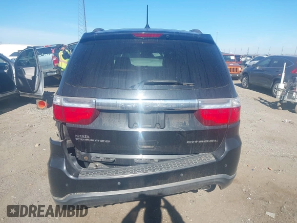 2013 Dodge Durango Citadel z VIN 1C4RDHEG2DC674736, wystawiony jako IAAI lot #40948649 z przebiegiem 75 461 mil mil oraz . Historia ofert i sprzedaży dostępna na DreamBid. Obrazek 16.