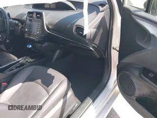 2021 Toyota Prius L Eco z VIN JTDKAMFU5M3137298, wystawiony jako IAAI lot #42270937 z przebiegiem 38 828 mil mil oraz . Historia ofert i sprzedaży dostępna na DreamBid. Obrazek 5.