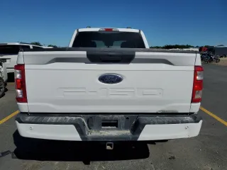 2021 Ford F-150 XL with VIN 1FTFX1E56MKD34057, listed as a Copart auction lot 63997585 with 99,679 mi miles and Clean title. Bid and sale history available at DreamBid. Image 6.