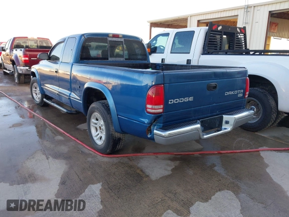 2003 Dodge Dakota SLT z VIN 1D7HL42N93S196397, wystawiony jako IAAI lot #42105857 z przebiegiem 159 690 mil mil oraz . Historia ofert i sprzedaży dostępna na DreamBid. Obrazek 3.