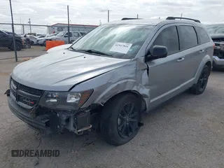 2019 Dodge Journey SE z VIN 3C4PDCBB5KT861358, wystawiony jako IAAI lot #41947841 z przebiegiem 82 099 mil mil oraz . Historia ofert i sprzedaży dostępna na DreamBid. Obrazek 2.