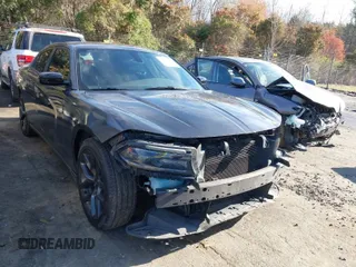 2020 Dodge Charger SXT with VIN 2C3CDXBG7LH101173, listed as a IAAI auction lot 41844489 with 157,773 mi miles. Bid and sale history available at carsss.com. Image 1.