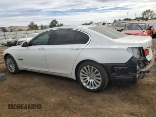 2013 BMW 7 Series 740i with VIN WBAYA6C58DC995137, listed as a Copart auction lot 75774104 with 61,847 mi miles and Salvage Title. Bid and sale history available at carsss.com. Image 2.