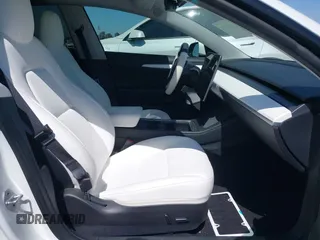 2023 Tesla Model 3 z VIN 5YJ3E1EA5PF517893, wystawiony jako IAAI lot #42515181 z przebiegiem 38 538 mil mil oraz . Historia ofert i sprzedaży dostępna na DreamBid. Obrazek 5.