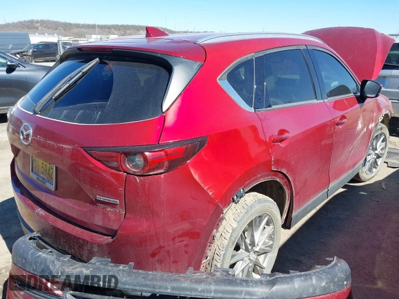 2020 Mazda CX-5 Grand Touring with VIN JM3KFADM3L0761286, listed as a IAAI auction lot 41715379 with 145,656 mi miles and . Bid and sale history available at DreamBid. Image 3.