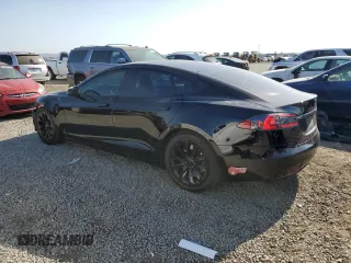 2016 Tesla Model S 90D with VIN 5YJSA1E20GF169954, listed as a Copart auction lot 61974475 with 124,560 mi miles and Salvage title. Bid and sale history available at DreamBid. Image 2.