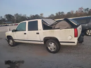 1996 Chevrolet Suburban z VIN 3GNFK16R7TG124404, wystawiony jako Copart lot #77361264 z przebiegiem 256 935 mil mil oraz Szkoda całkowita • Salvage title. Historia ofert i sprzedaży dostępna na DreamBid. Obrazek 2.