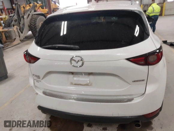 2020 Mazda CX-5 Grand Touring with VIN JM3KFBDM6L1828611, listed as a IAAI auction lot 42006976 with 59,939 mi miles and . Bid and sale history available at DreamBid. Image 17.