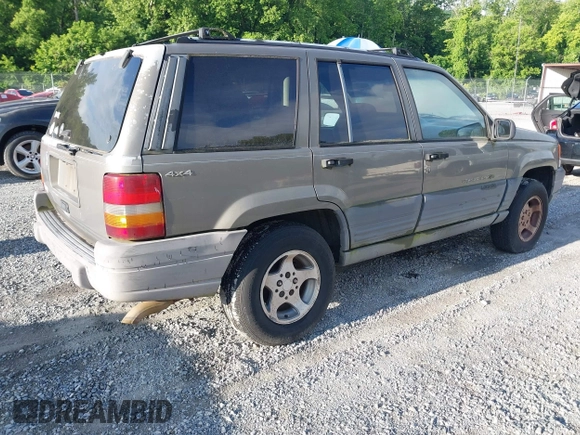 1997 Jeep Grand Cherokee Laredo with VIN 1J4GZ58S1VC603868, listed as a IAAI auction lot 42467813 with 297,306 mi miles and . Bid and sale history available at DreamBid. Image 4.