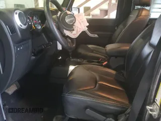 2014 Jeep Wrangler Unlimited Rubicon with VIN 1C4HJWFG7EL302897, listed as a Copart auction lot 48969425 with 57,976 mi miles and Salvage title. Bid and sale history available at DreamBid. Image 7.