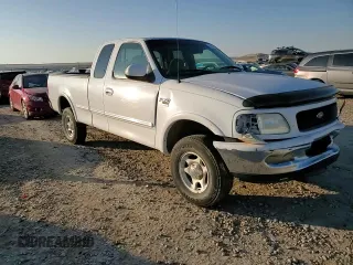 1998 Ford F-150 z VIN 1FTZX18W3WKB01774, wystawiony jako Copart lot #88670315 z przebiegiem 102 301 mil mil oraz Szkoda całkowita • Salvage title. Historia ofert i sprzedaży dostępna na DreamBid. Obrazek 10.