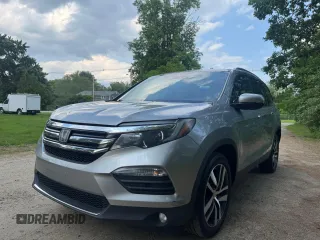 2018 Honda Pilot Touring z VIN 5FNYF6H94JB070661, wystawiony jako Copart lot #60926415 z przebiegiem 205 538 mil mil oraz Czysty tytuł • Clean title. Historia ofert i sprzedaży dostępna na DreamBid. Obrazek 2.
