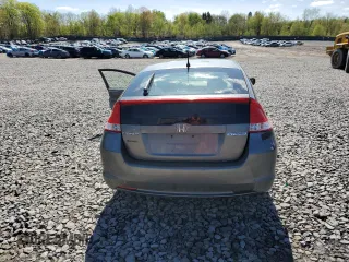 2010 Honda Insight LX z VIN JHMZE2H59AS000085, wystawiony jako Copart lot #54932975 z przebiegiem 218 961 mil mil oraz Szkoda całkowita • Salvage title. Historia ofert i sprzedaży dostępna na DreamBid. Obrazek 6.