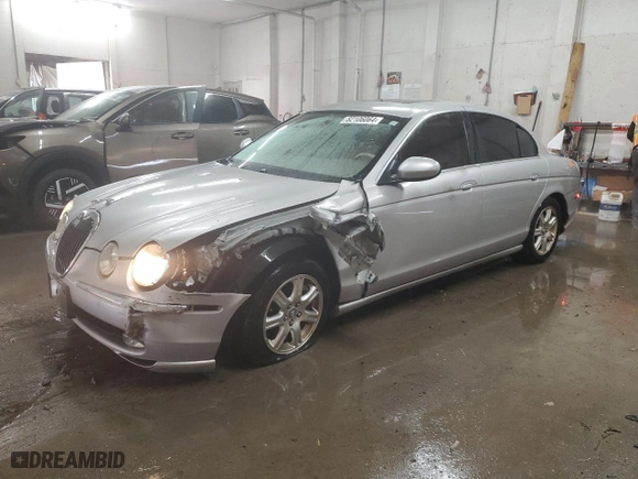 2004 Jaguar S-Type with VIN SAJEA01T74FN12824, listed as a Copart auction lot 82106064 with 0 mi miles and Salvage Title. Bid and sale history available at carsss.com. Image 1.