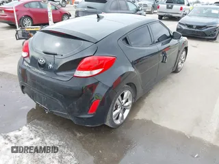2013 Hyundai Veloster w/Black Int z VIN KMHTC6ADXDU149793, wystawiony jako IAAI lot #41537953 z przebiegiem 117 635 mil mil oraz . Historia ofert i sprzedaży dostępna na DreamBid. Obrazek 4.