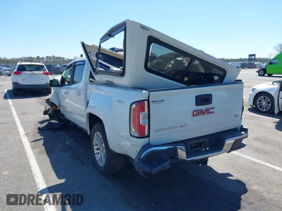 2018 GMC Canyon 4WD SLT z VIN 1GTG6DEN1J1146038, wystawiony jako IAAI lot #42069492 z przebiegiem 63 316 mil mil oraz . Historia ofert i sprzedaży dostępna na DreamBid. Obrazek 3.