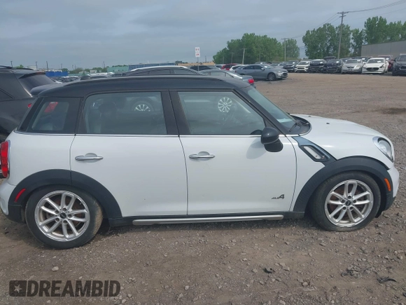 2015 MINI Countryman S with VIN WMWZC5C59FWM18935, listed as a IAAI auction lot 42427878 with 121,410 mi miles and . Bid and sale history available at DreamBid. Image 13.