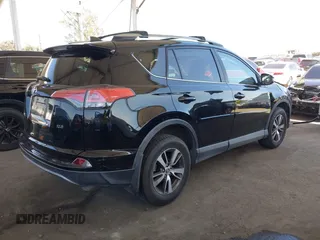 2018 Toyota RAV4 XLE with VIN 2T3WFREV2JW502622, listed as a IAAI auction lot 42327598 with 94,997 mi miles and . Bid and sale history available at DreamBid. Image 4.