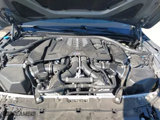 2023 BMW M8 Competition with VIN WBSAE0C0XPCM48877, listed as a IAAI auction lot 41676318 with 18,572 mi miles. Bid and sale history available at carsss.com. Image 10.