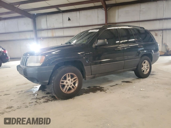 2003 Jeep Grand Cherokee Laredo with VIN 1J4GX48S13C601387, listed as a Copart auction lot 60544295 with 217,485 mi miles and Salvage title. Bid and sale history available at DreamBid. Image 1.
