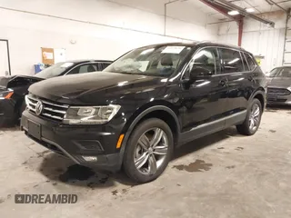 2021 Volkswagen Tiguan SE with VIN 3VV2B7AXXMM034880, listed as a IAAI auction lot 41979636 with 34,490 mi miles and . Bid and sale history available at DreamBid. Image 2.