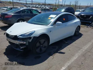 2018 Tesla Model 3 Long Range Battery with VIN 5YJ3E1EA3JF057527, listed as a IAAI auction lot 42072126 with 1 mi miles. Bid and sale history available at carsss.com. Image 2.