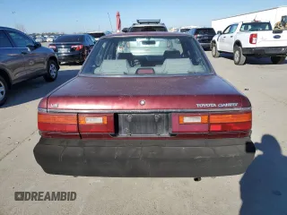 1990 Toyota Camry z VIN JT2SV21E7L3411990, wystawiony jako Copart lot #88557555 z przebiegiem 335 803 mil mil oraz Szkoda całkowita • Salvage title. Historia ofert i sprzedaży dostępna na DreamBid. Obrazek 6.