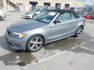2012 BMW 1 Series 128i with VIN WBAUN1C52CVR00421, listed as a IAAI auction lot 41594256 with 107,957 mi miles and . Bid and sale history available at DreamBid. Image 2.