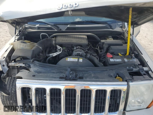 2009 Jeep Commander Sport with VIN 1J8HH48K59C514861, listed as a Copart auction lot 44076015 with 129,674 mi miles and Salvage title. Bid and sale history available at DreamBid. Image 12.