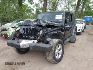 2013 Jeep Wrangler Unlimited Sahara with VIN 1C4BJWEG2DL549864, listed as a IAAI auction lot 42250556 with 231,018 mi miles and . Bid and sale history available at DreamBid. Image 2.