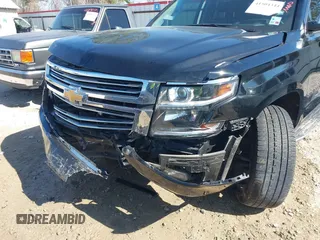 2019 Chevrolet Suburban LT with VIN 1GNSCJKC5KR360318, listed as a IAAI auction lot 41504344 with 82,997 mi miles and . Bid and sale history available at DreamBid. Image 6.