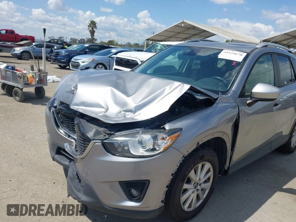 2014 Mazda CX-5 Touring z VIN JM3KE2CYXE0322943, wystawiony jako IAAI lot #41934670 z przebiegiem 110 690 mil mil oraz . Historia ofert i sprzedaży dostępna na DreamBid. Obrazek 6.