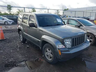 2012 Jeep Liberty Sport with VIN 1C4PJMAK1CW198611, listed as a IAAI auction lot 42187221 with 118,623 mi miles. Bid and sale history available at carsss.com. Image 1.
