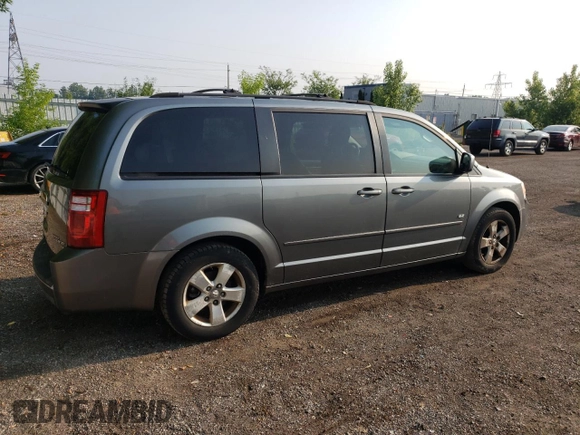 2009 Dodge Grand Caravan SE with VIN 2D8HN44E29R694728, listed as a Copart auction lot 60287565 with 233,018 mi miles and Clean title. Bid and sale history available at DreamBid. Image 3.