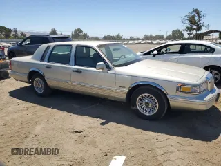 1997 Lincoln Town Car Executive with VIN 1LNLM81W8VY734974, listed as a Copart auction lot 61440195 with 94,982 mi miles and Clean title. Bid and sale history available at DreamBid. Image 4.